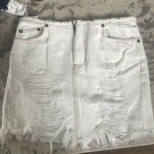 White Carmar ripped skirt with golden trim